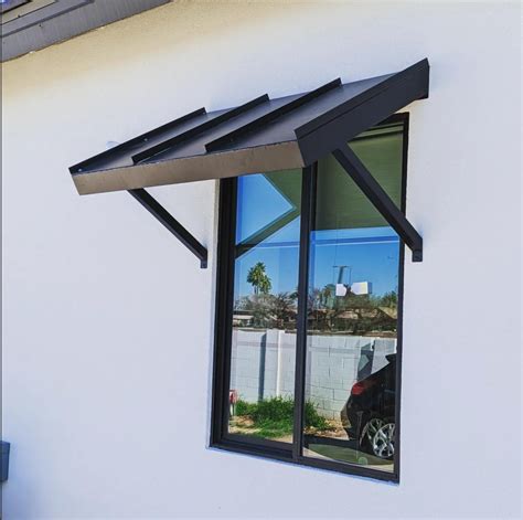 black metal awnings on a cream color house|Black Modern Awning Design Ideas .